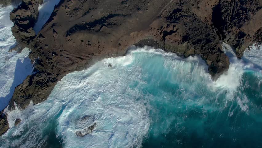 Aerial drone view of mountain sea and volcanoes in Lanzarote, Canary Islands, Spain