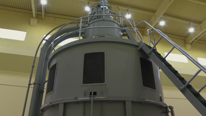 Mockup of a hydroelectric dam turbine spinning.
