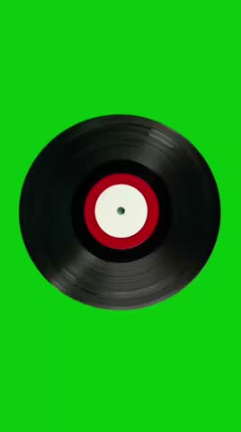 Spinning vinyl record on a green background