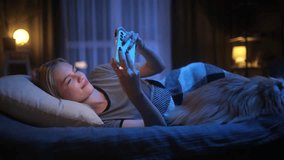 Beautiful Blond Woman Playing Game on Smartphone in the Bed at Night, Addict Social Media - Powered by Shutterstock - Get 15% off with code: PIKWIZARD15