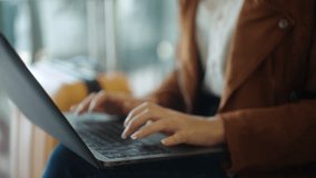 Close up of business woman hands turning on laptop for working remotely online at the airport terminal, young female browsing the internet for emailing and managing e-business.
 - Powered by Shutterstock - Get 15% off with code: PIKWIZARD15
