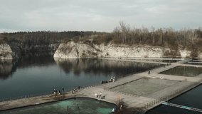 Pool ladder on a cottage wooden pier in a lake in Zakrzowek lake, Krakow, Poland. High quality photo - Powered by Shutterstock - Get 15% off with code: PIKWIZARD15