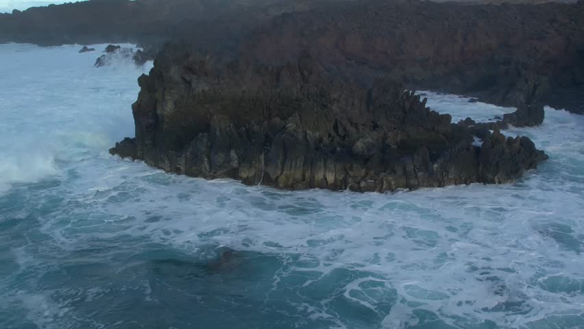 Aerial drone view of mountain sea and volcanoes in Lanzarote, Canary Islands, Spain