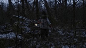 young girl finding her way through the forest with a lantern as the sun sets - Powered by Shutterstock - Get 15% off with code: PIKWIZARD15