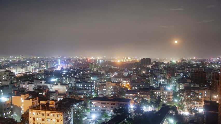 A mesmerizing timelapse of the Dhaka skyline from Mohammadpur, capturing the rising moon as it illuminates the urban landscape.