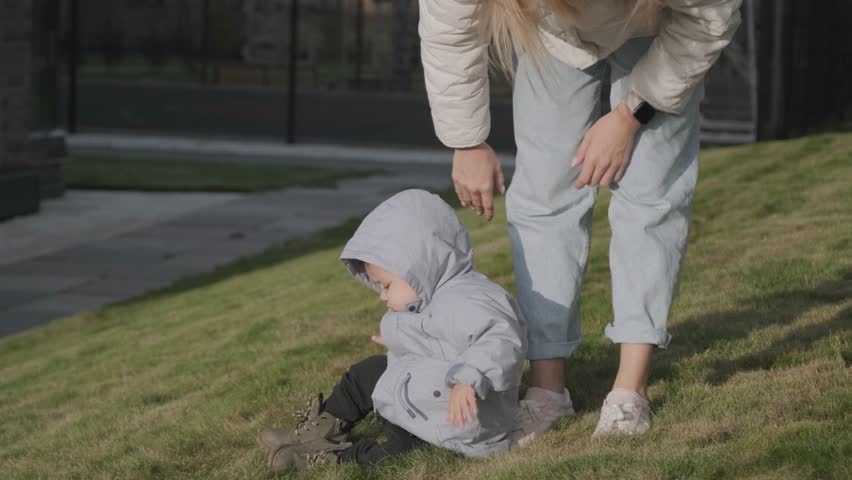 Baby with mother on a walk in autum time