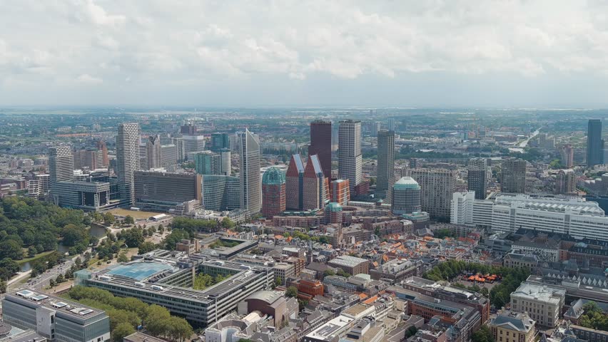The Hague, Netherlands. Business center of The Hague. Large train station Den Haag Centraal. Cloudy weather. Summer day. Stable, Aerial View, Point of interest