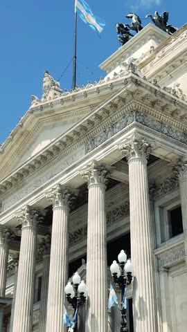 Vertical view of the National Congress building, Argentine flag over the Sky, chamber of Deputies