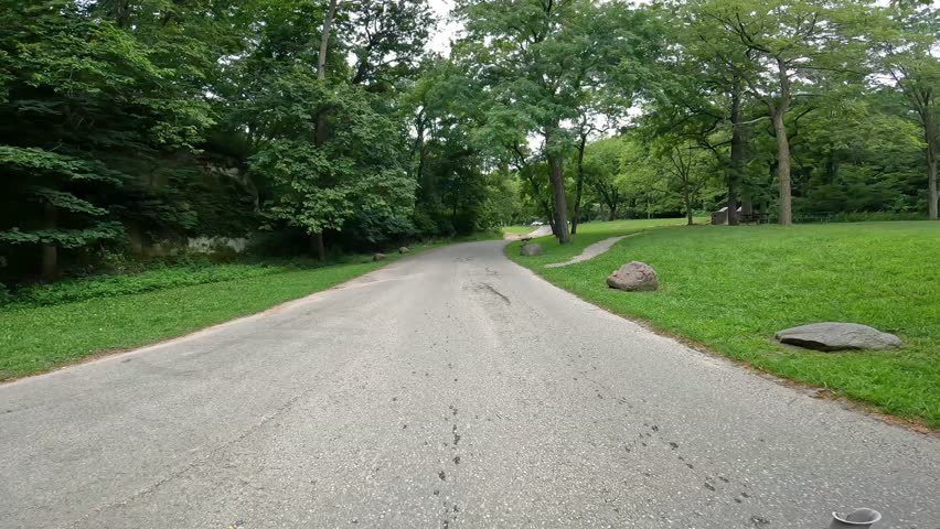POV - Driving on the park road in Ledges State Park in central Iowa; driving thru a ford where Peas Creek flows over the park road; pedestrian stone bridge over the creek; outdoor adventures