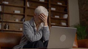 Frustrated senior woman stressed while using laptop - Powered by Shutterstock - Get 15% off with code: PIKWIZARD15