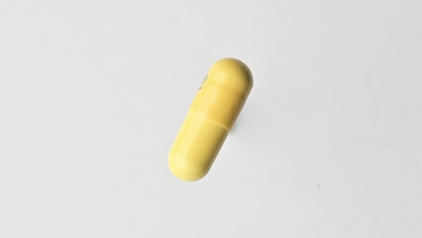 A rotating yellow tablet. Smooth playback. The yellow Pill is on the move.