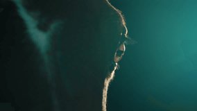 Extreme Closeup of Horse Eye Illuminated By Teal Backlight in Dark Room - Powered by Shutterstock - Get 15% off with code: PIKWIZARD15