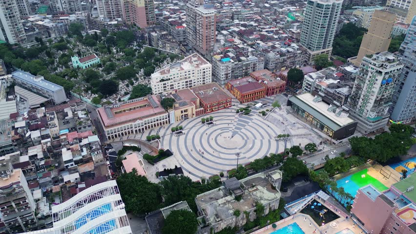 Macau, China: Aerial drone footage of the iconic Tap Seac Square with the Central Library and other colonial style buildings in Macau city center in China. 
