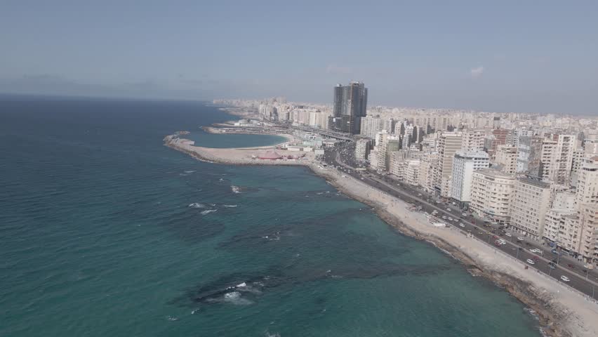 Aerial drone footage of the Mediterranean Corniche in Alexandria, Egypt.