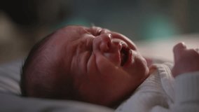 Authentic Close Up Footage of Crying Newborn Baby Lying on the Back in Child Crib. Mother Soothing a Caucasian Neonate Toddler at Home in Kids Bedroom. Concept of Childhood, New Life and Parenthood. - Powered by Shutterstock - Get 15% off with code: PIKWIZARD15