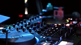 Close-up of the hands of a DJ working in a nightclub at the console. - Powered by Shutterstock - Get 15% off with code: PIKWIZARD15