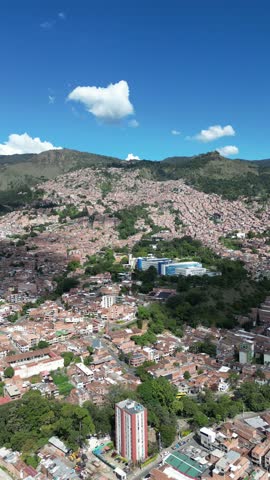 Experience Medellín, Colombia, through an aerial view capturing its vibrant cityscape, surrounded by the majestic Andes Mountains and lush greenery. Perfect for cultural and travel-focused projects.