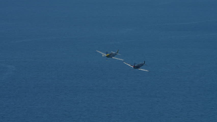 Two of the greatest WW2 fighters A Merlin Spitfire and a P-51 Mustang flying together