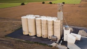 Grain silo storage facility with IoT smart sensor monitoring for optimized crop growth - aerial view concept animation of production - Powered by Shutterstock - Get 15% off with code: PIKWIZARD15