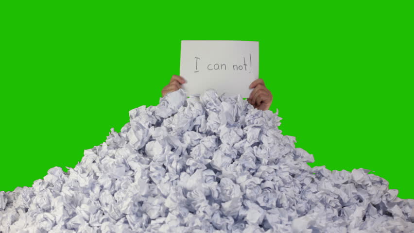 Green background (Chroma Key). New crumpled paper ball are added to the heap.