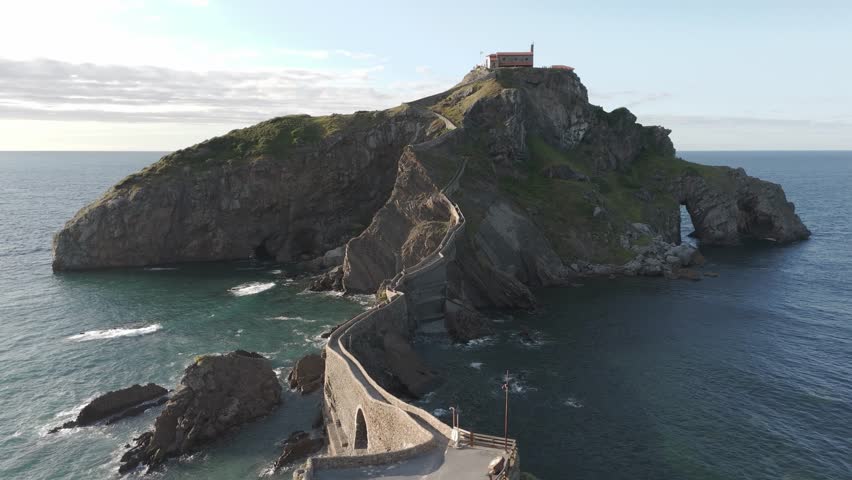 Aerial drone fly Gaztelugatxe coast Islet in Spain game of thrones set landscape