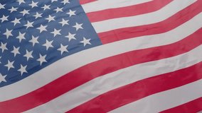 United States of America flag. Close up of United States flag waving in the wind. The stars and stripes ripple showing the patriotic red white blue colors. USA nation flag Symbol of freedom waving. - Powered by Shutterstock - Get 15% off with code: PIKWIZARD15