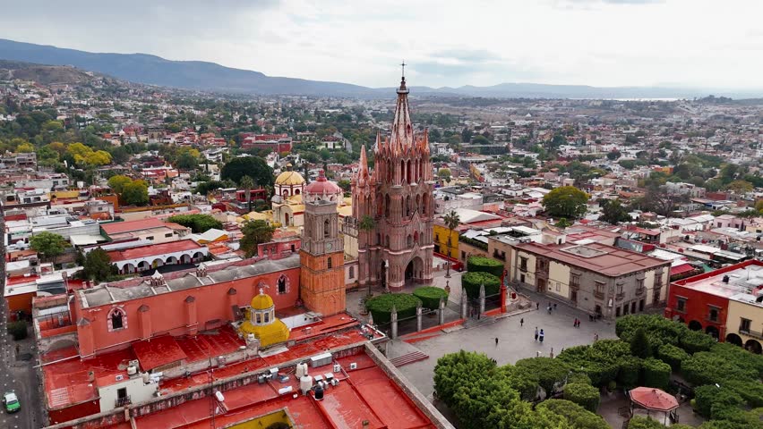 San Miguel Arcangel Parish in San Miguel de Allende, Mexico. Drone shot approaching the church flying over the town