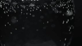 Macro of sparkling water with bubbles creating vibrant and crisp liquid textures, macro abstract backdrop - Powered by Shutterstock - Get 15% off with code: PIKWIZARD15