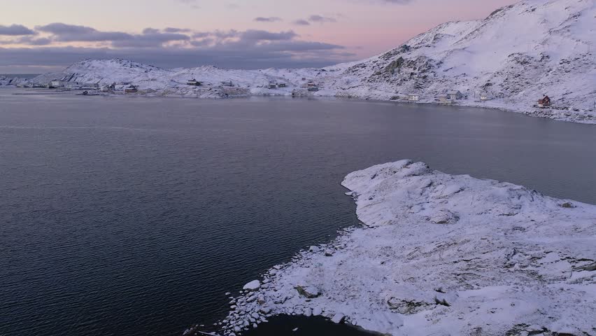 Snow-Covered Cutter Wreck Abandoned in a Frozen Fjord Under Norway’s Bleak Winter Sky