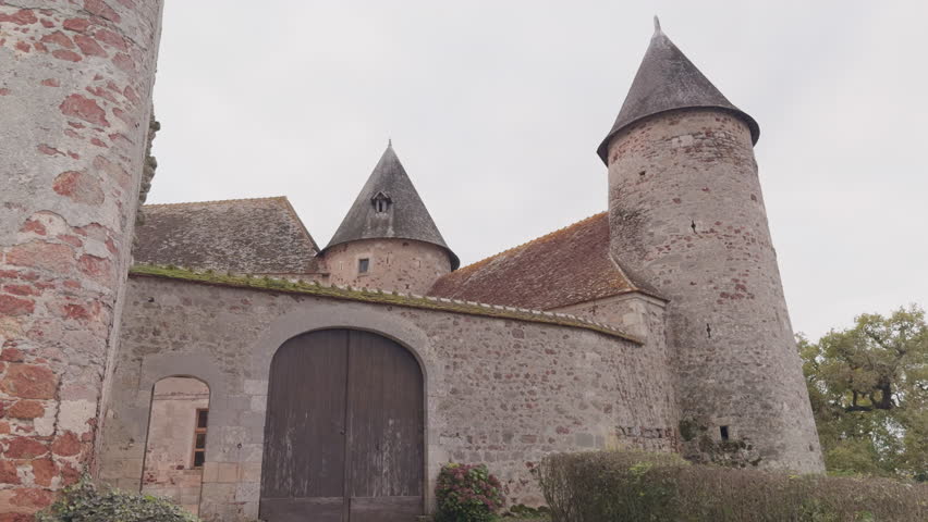 Low angle view of Château du Bouchet (Castle of Le Bouchet), in Rosnay, France. Castle is surrounded by the ponds of La Brenne, built between the 12th-17th centuries.