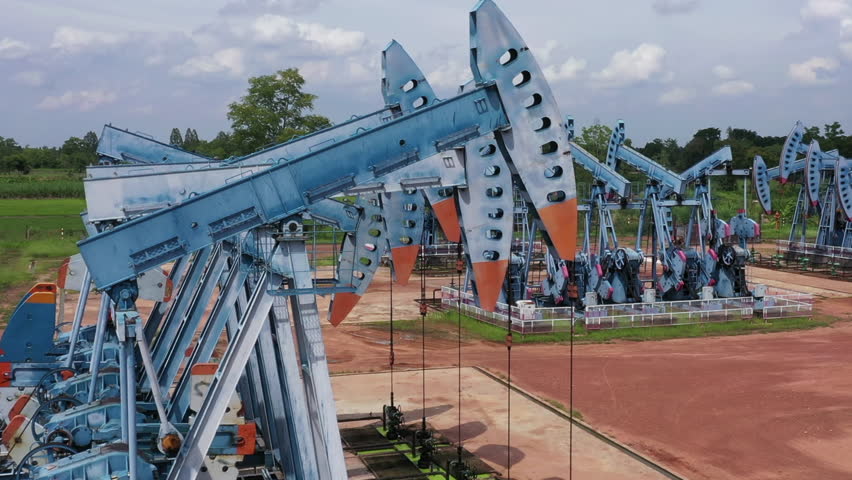   Working oil pump jack on a oil field Oil and gas industry