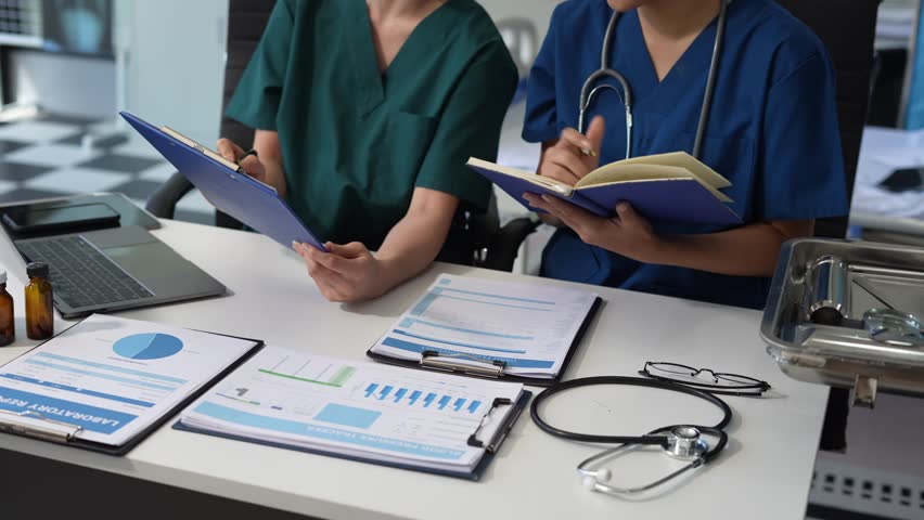 Medical students working on laptop computer and tablet and medical stethoscope on clipboard on desk. - Powered by Shutterstock - Get 15% off with code: PIKWIZARD15