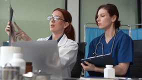Medical Team Using Digital Tablet for Healthcare, Doctor Technology, X-Ray Analysis. - Powered by Shutterstock - Get 15% off with code: PIKWIZARD15