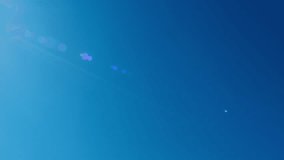 Bright Sun Of Spring Midday Sunlight At Daylight Sunshine Day. Clear Blue Sky With Lens Flares In Day. Nice Weather. Fresh Air. - Powered by Shutterstock - Get 15% off with code: PIKWIZARD15