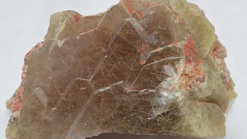 Golden Rutile Inclusion in Quartz Specimen Close-Up.