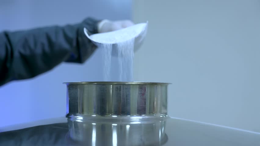 powder medicine mixing and blending process close up. dusting powder chemical pharma ingredient in a large equipment production line in a pharma manufacturing plant factory	
