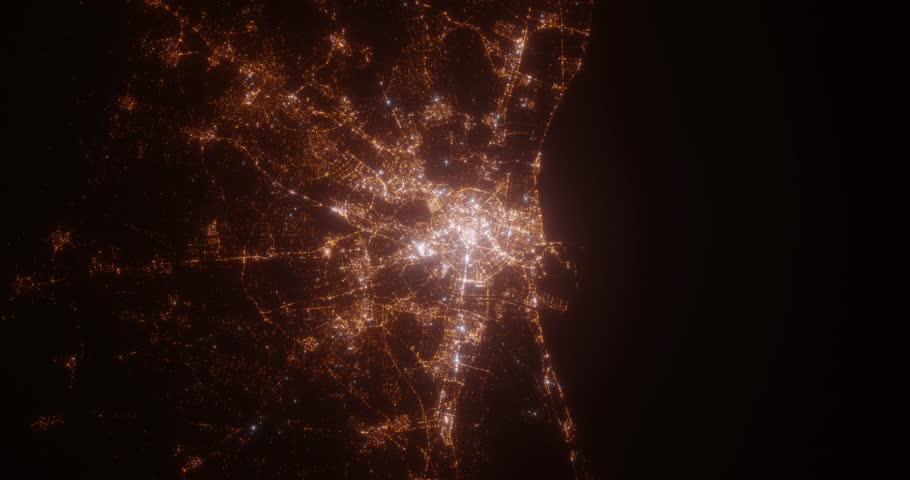 Valencia (Spain) aerial view at night. View on modern city from space. Camera is zooming in, rotating counterclockwise