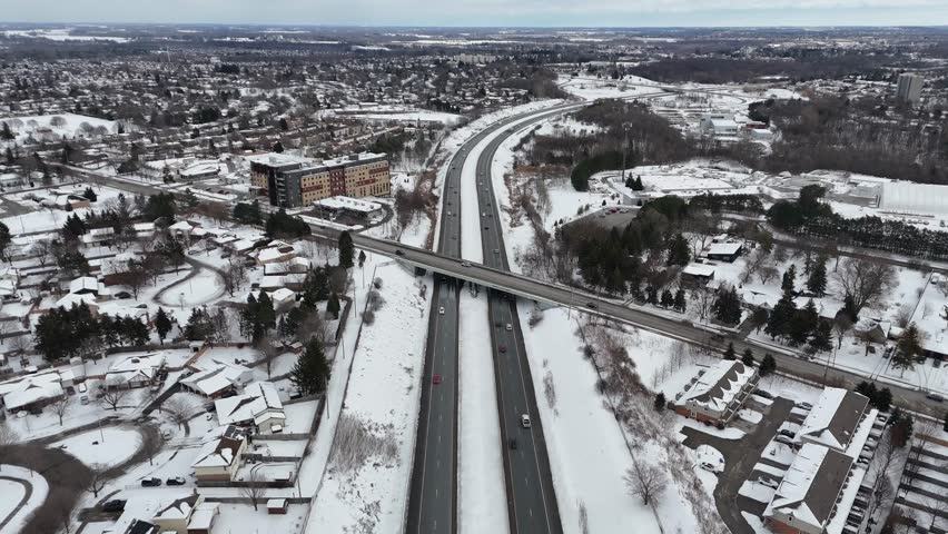 A breathtaking aerial view of Waterloo, Ontario with 
Interchange highway in a snowy winter