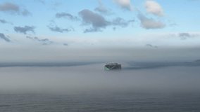aerial view of a container ship sailing in the mist - Powered by Shutterstock - Get 15% off with code: PIKWIZARD15