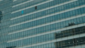 Contemporary high-rise office building with reflective glass facade, showcasing geometric design and urban architecture in Bangkok, Thailand. - Powered by Shutterstock - Get 15% off with code: PIKWIZARD15