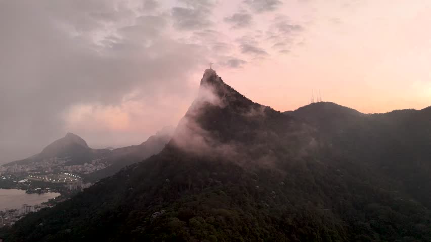 Aerial flythrough through clouds towards Christ the Redeemer statue, Rio de Janeiro