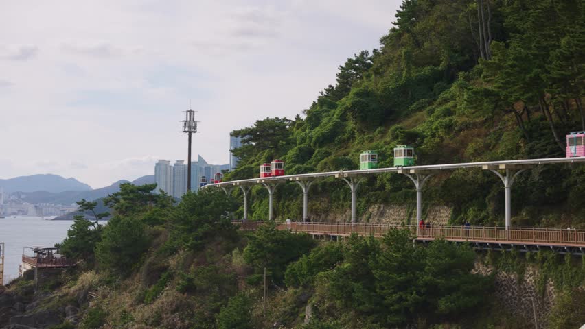 Busan and Haeundae Beach Coastline, Sky Capsule Trains Establishing Shot
