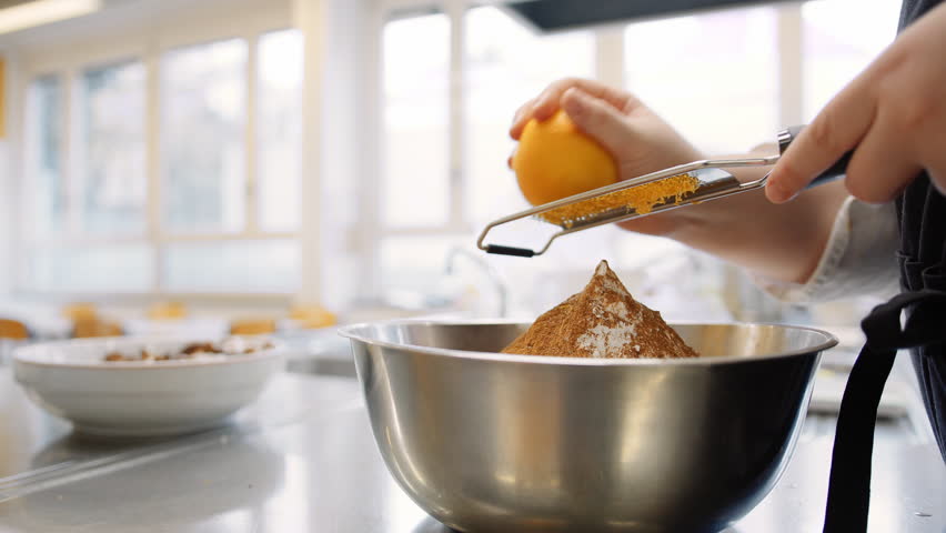 Zesting orange with a grater