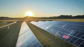 Vast solar farm with countless panels under intense sunlight. Digital battery icons overlay the panels, gradually filling up, symbolizing renewable energy storage and modern power supply. Green energy - Powered by Shutterstock - Get 15% off with code: PIKWIZARD15