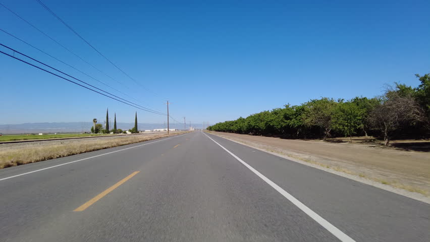 San Joaquin Valley Farmland Buttonwillow 03 Front View Driving Plates of Highway 58 West California USA