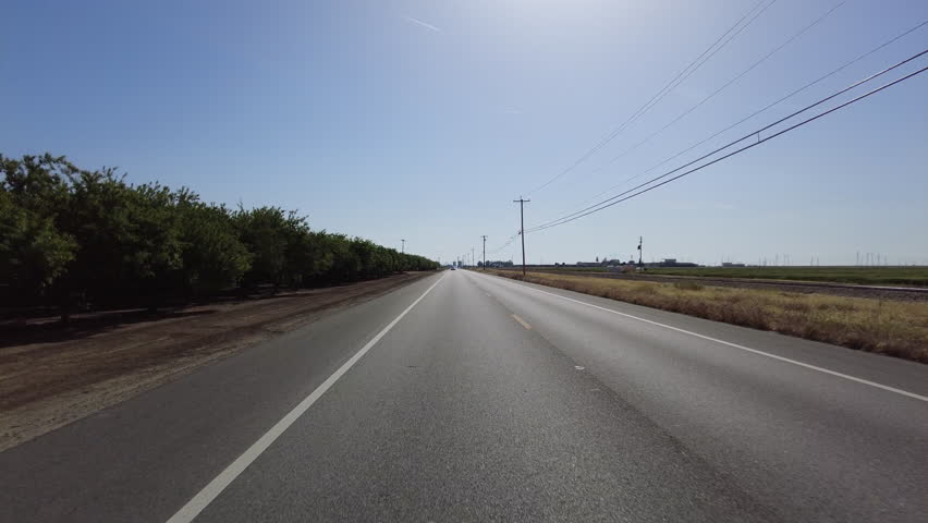 San Joaquin Valley Farmland Buttonwillow 03 Rear View Driving Plates of Highway 58 West California USA