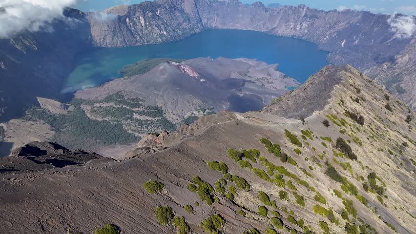 Segara Anak, Volcanic Crater Lake On The Summit Of Mount Rinjani In Summer In Indonesia. - aerial shot