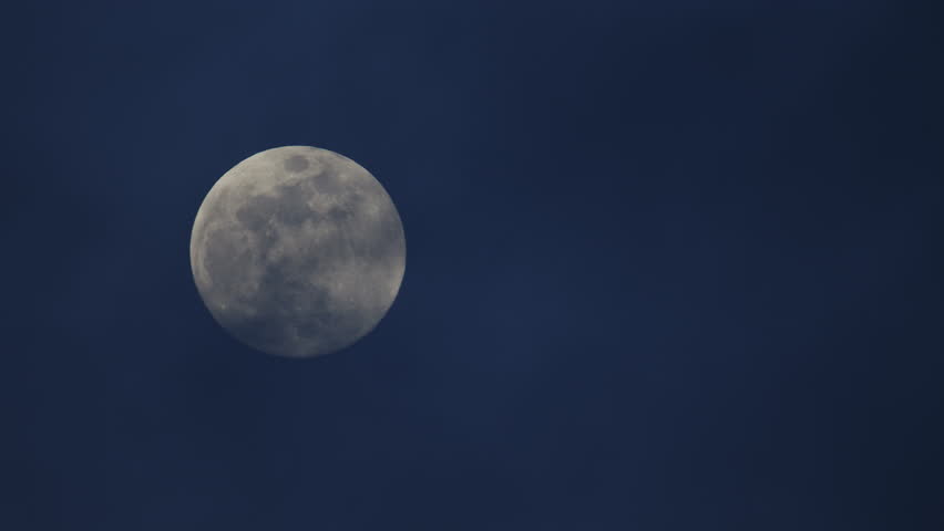 Full moon - super moon moves through the night sky.