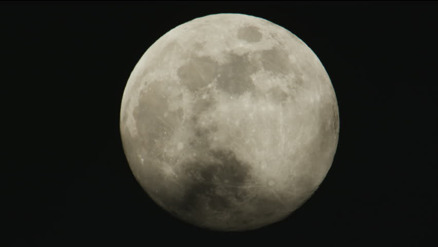 Full moon - super moon moves through the night sky.