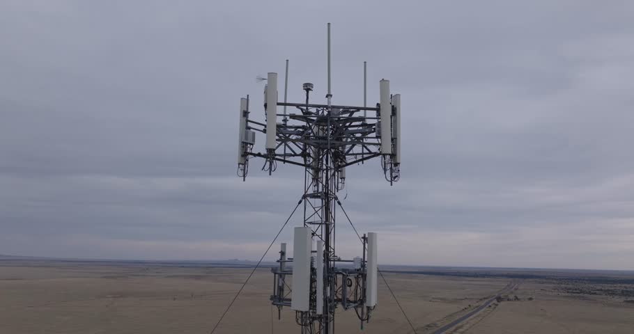 High aerial view of a cellular tower in Texas surrounded by vast open landscape